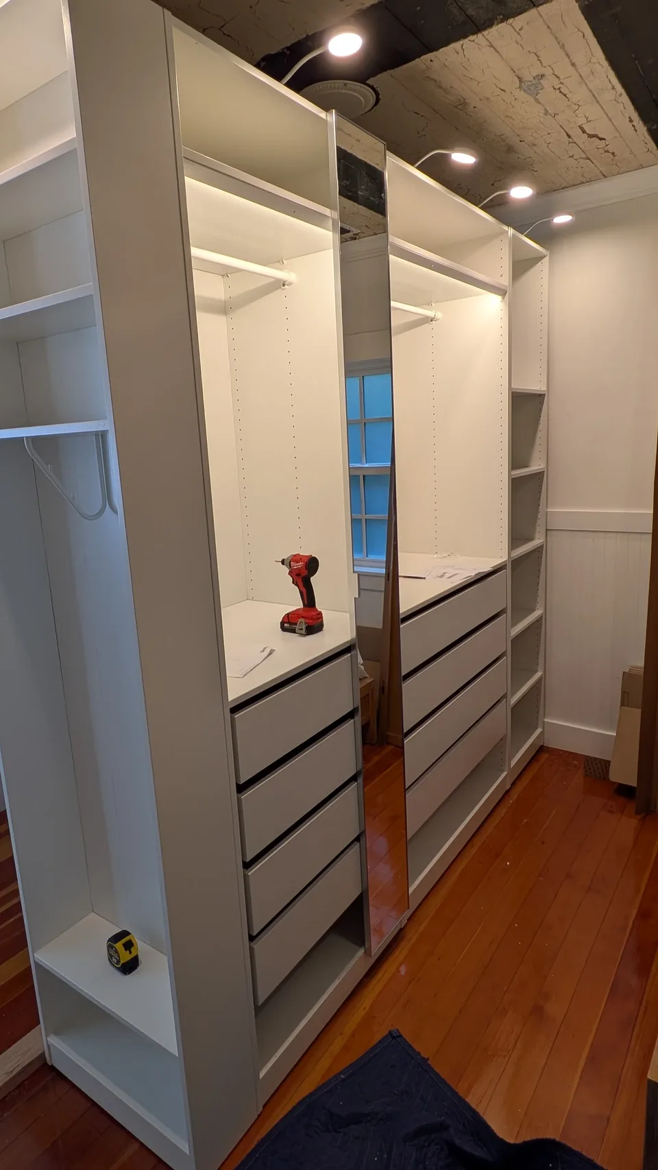 Drawer and lighting details from a separate wardrobe assembly.